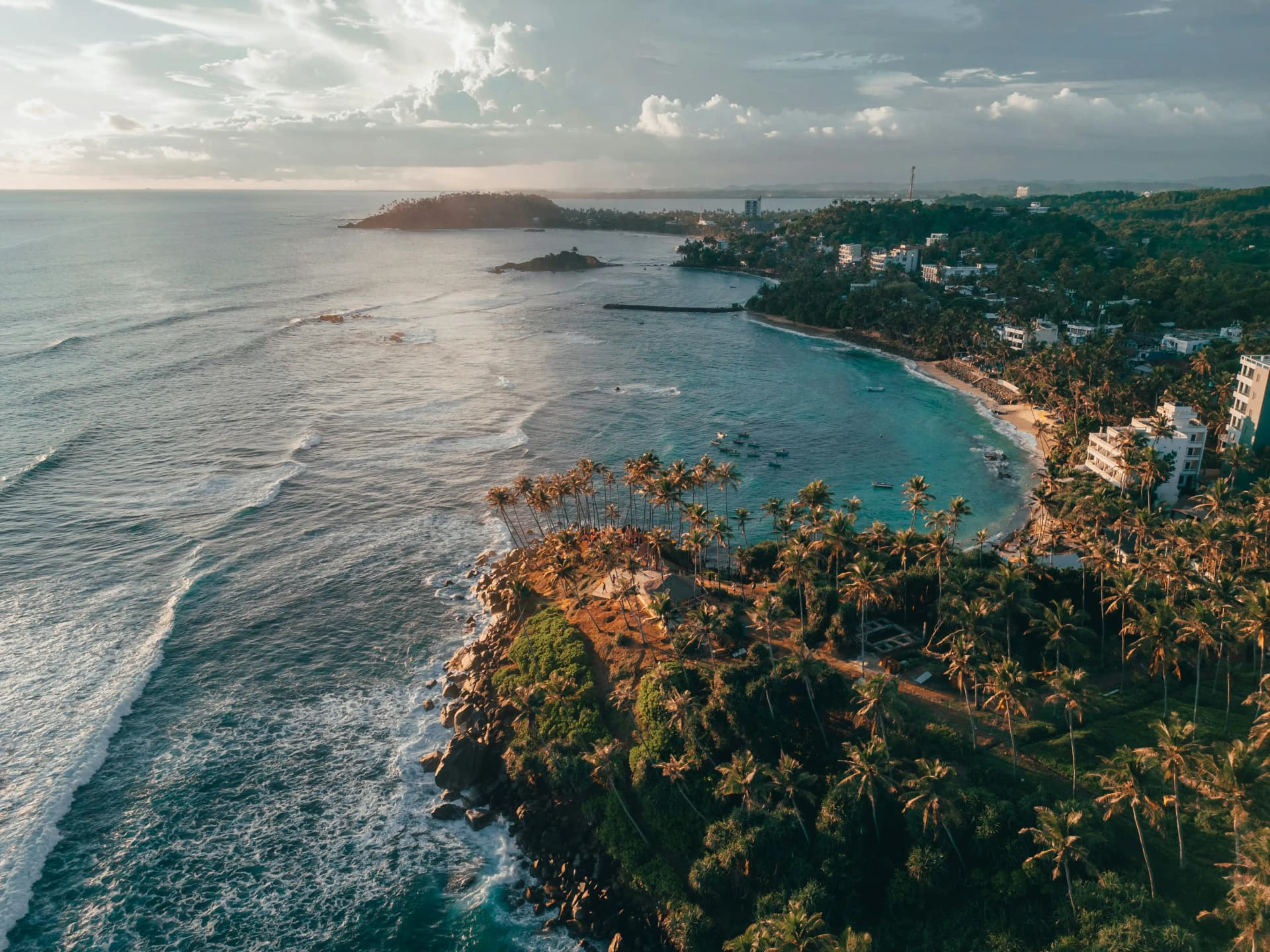 Mirissa beach at sunset by Sarmat Batagov